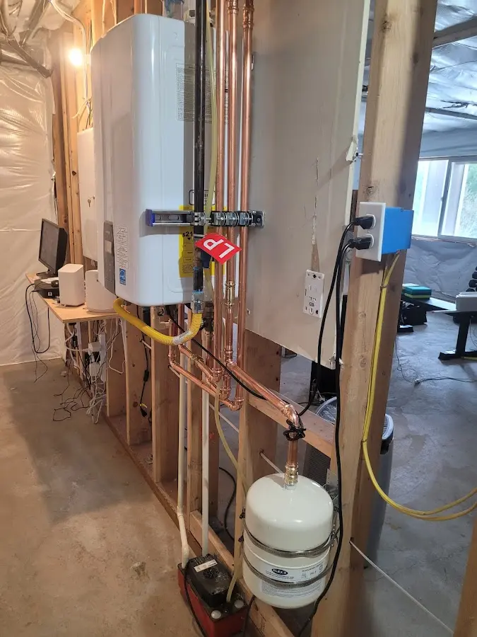 Licensed plumber repairing a kitchen sink in Piggott