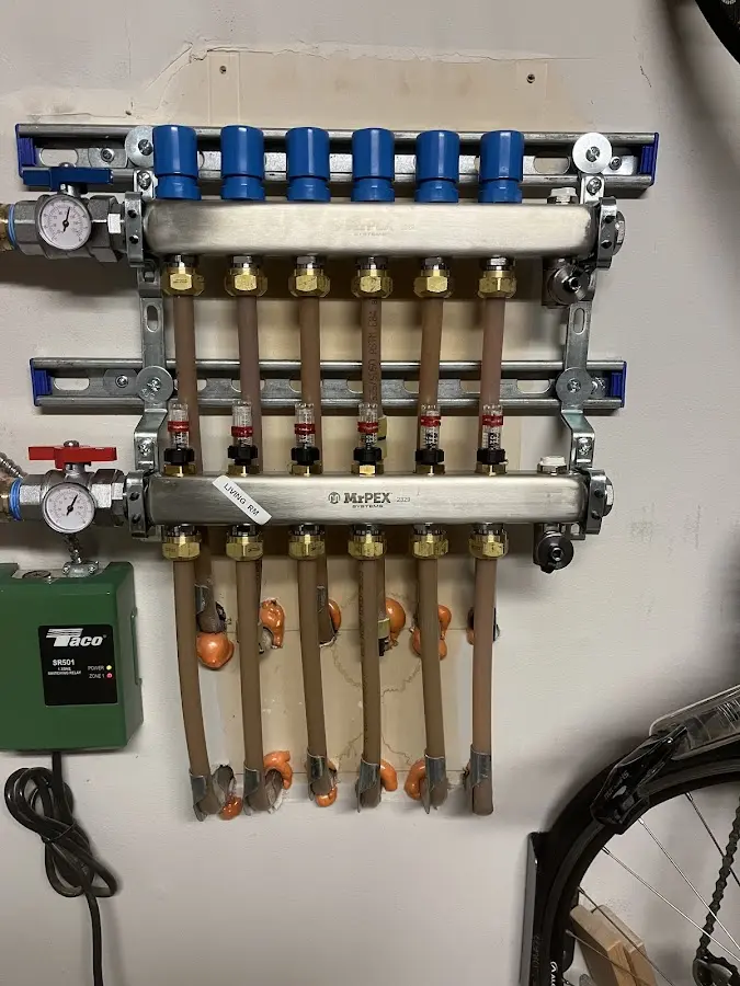 Plumber performing Water Heater Repair at a residential property in Piggott